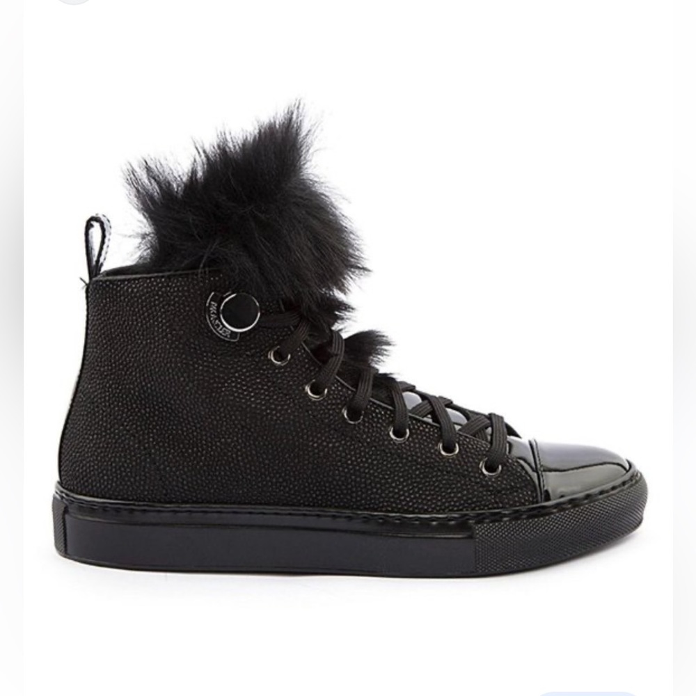 Moncler lace up booties with fur tongue.